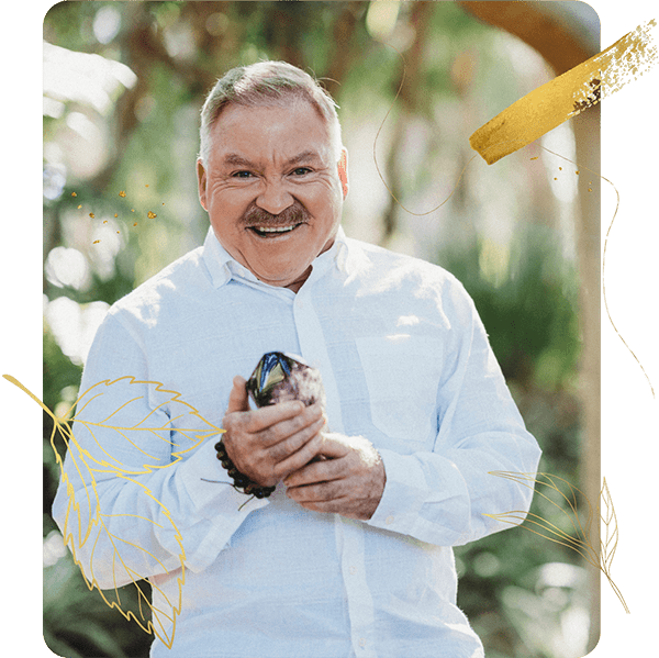 James Van Praagh holding a crystal